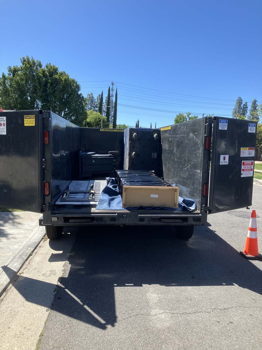 Office furniture and equipment loaded for a commercial cleanout in the San Fernando Valley